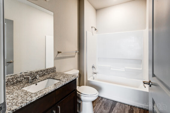 Apartment bathroom featuring a large tub